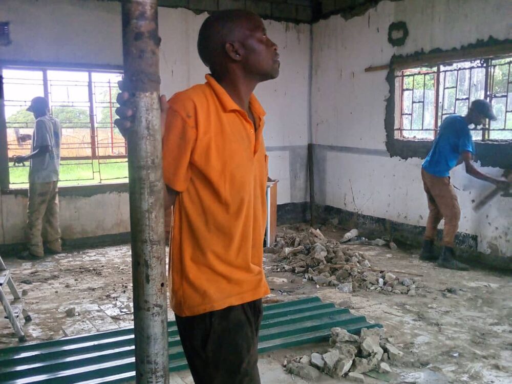 The men of the community helped with the construction work.