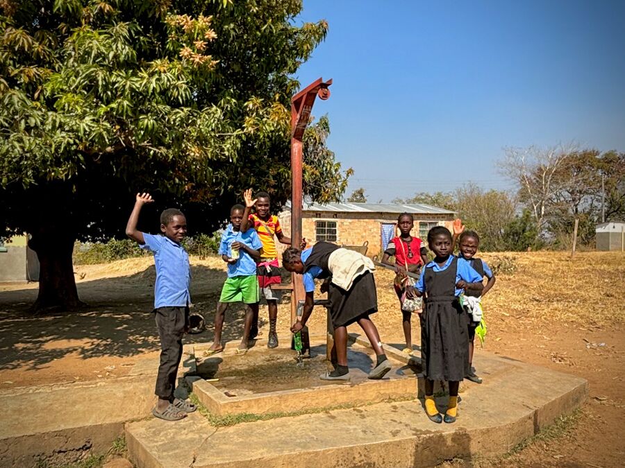 Children from the school at the existing well