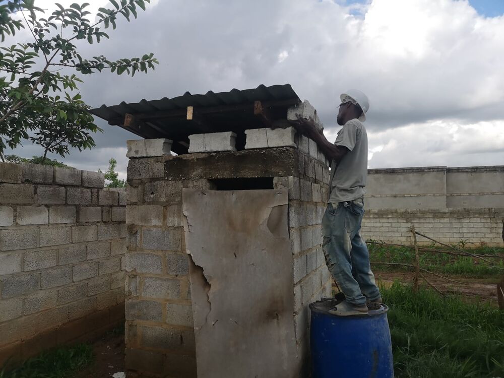 In the end, there was even material left over to repair the roof of the only toilet on the premises.